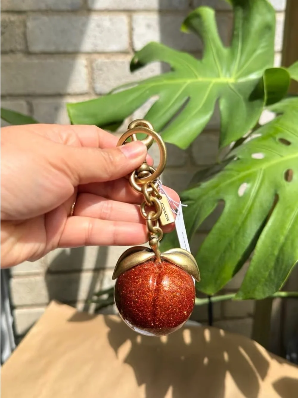 Coach Gold-Tone & Sparkling Orange Peach Keychain